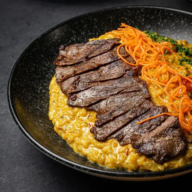 Risotto de Hongo Porcini y Churrasco de Gambino Pasta en Santo Domingo